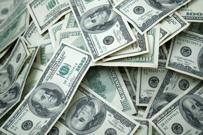 pile of hundred dollar bills full frame shot