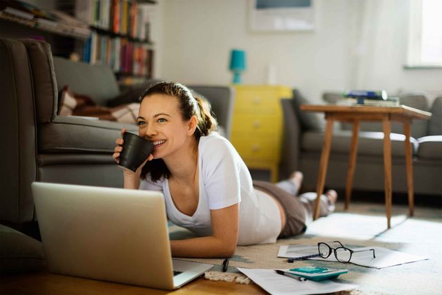 woman on floor with laptop