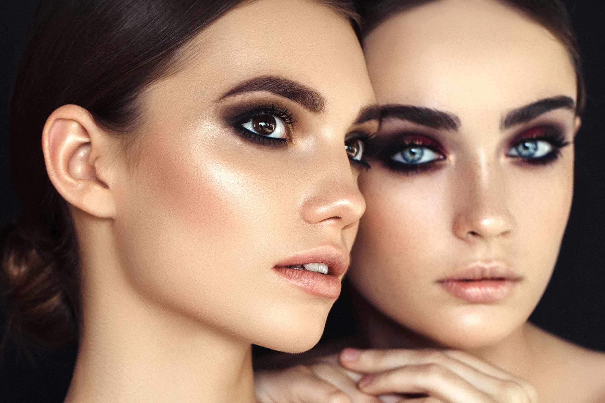 two dark-haired women with lots of eye makeup