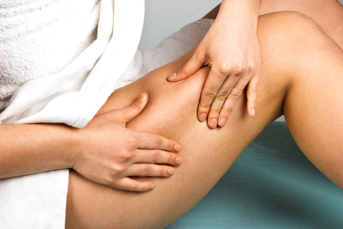 Woman looking at thigh