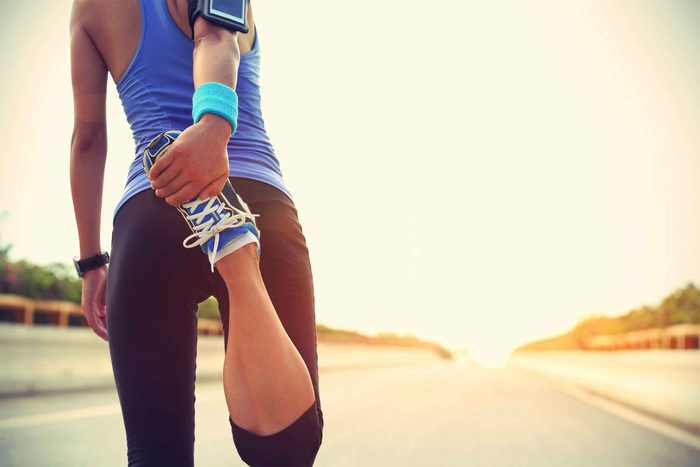 Woman stretching during a run