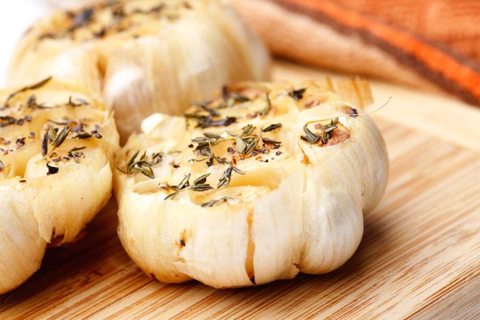 head of roasted garlic with spices