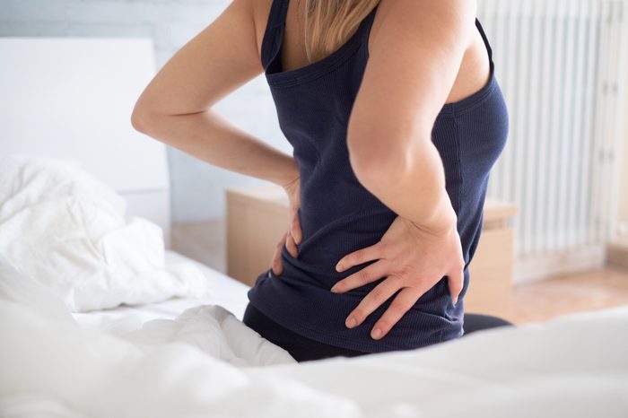 woman stretching back in the morning