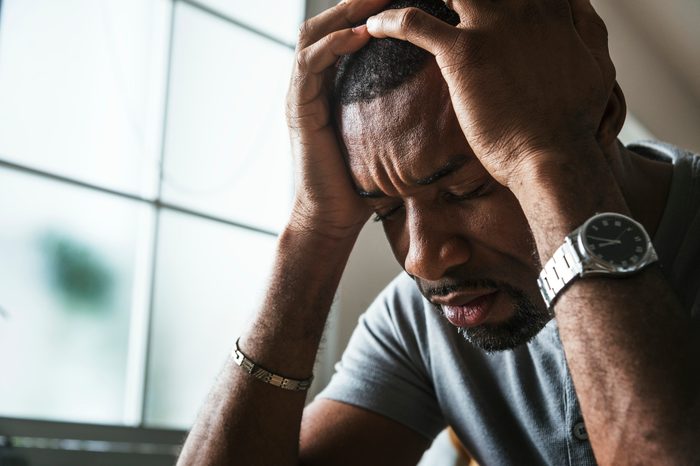 young man stressed out crying