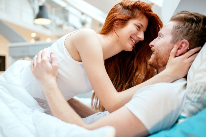 man and woman on bed