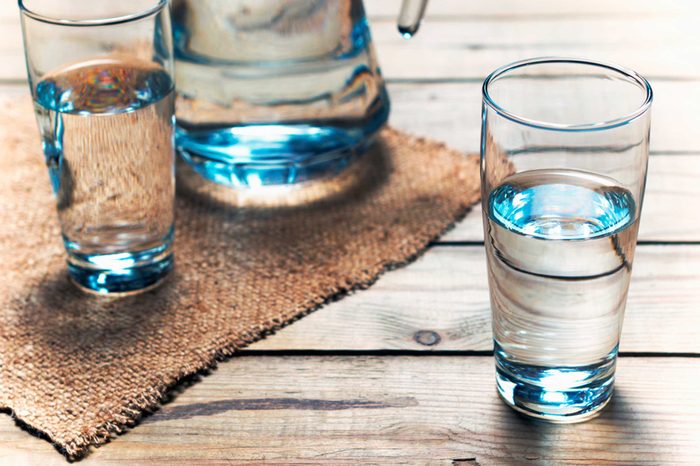 glass of water next to pitcher of water