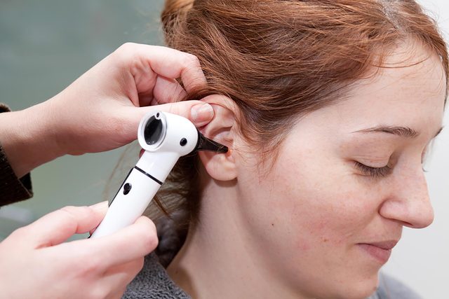 doctor checking hearing