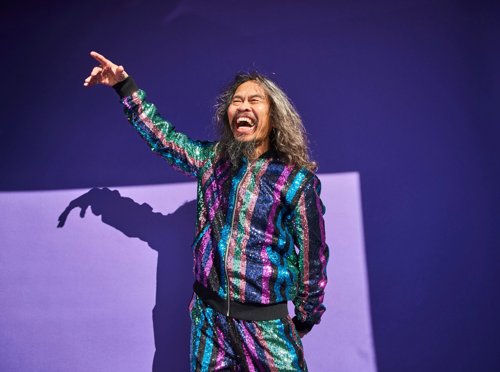 happy man on purple background
