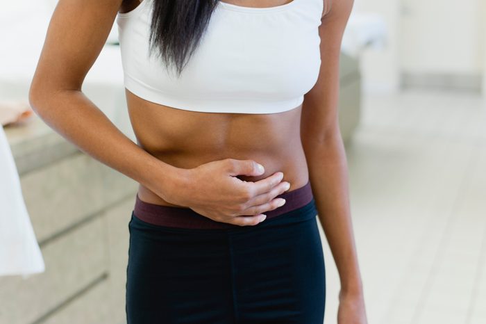 woman with hand on her stomach