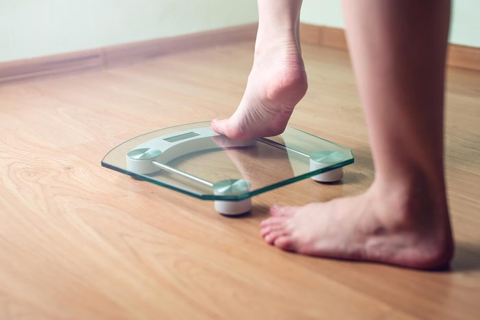 feet stepping on scale