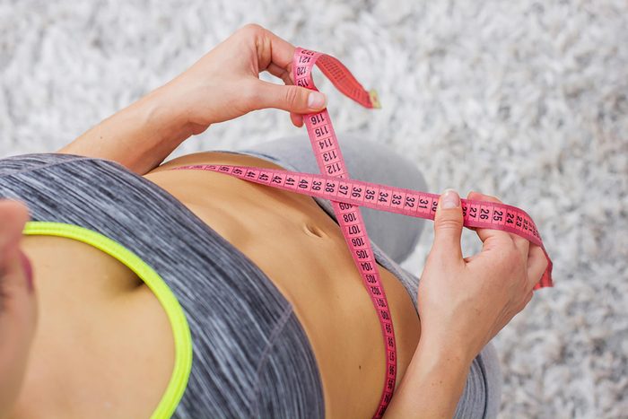 woman tape measure on waist