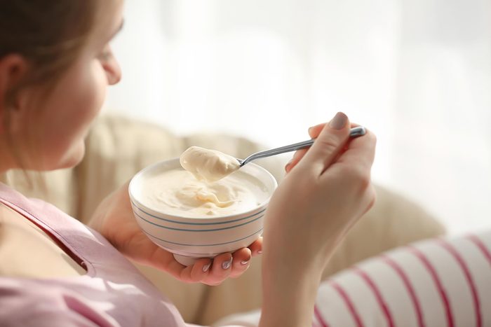 woman eating yogurt