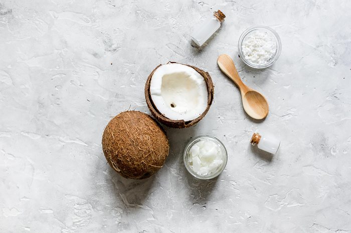 a coconut shell split in half on a white surface