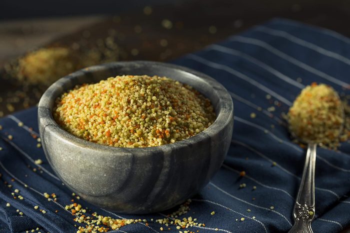 Couscous in bowl with spoon