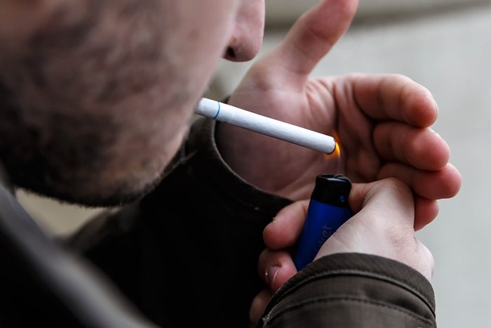 Man lighting a cigarette