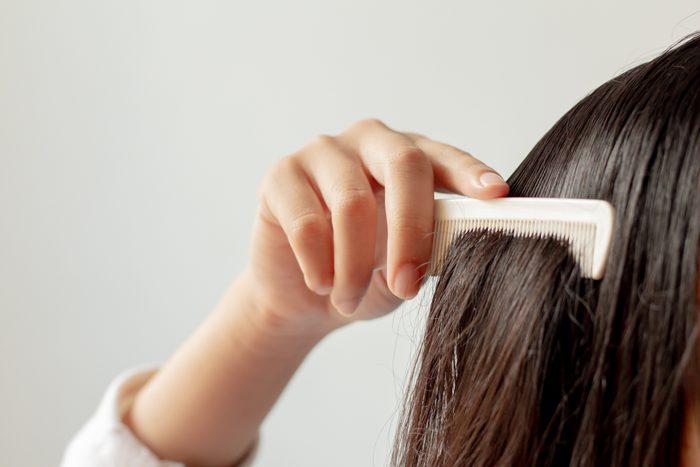 combing through hair close up