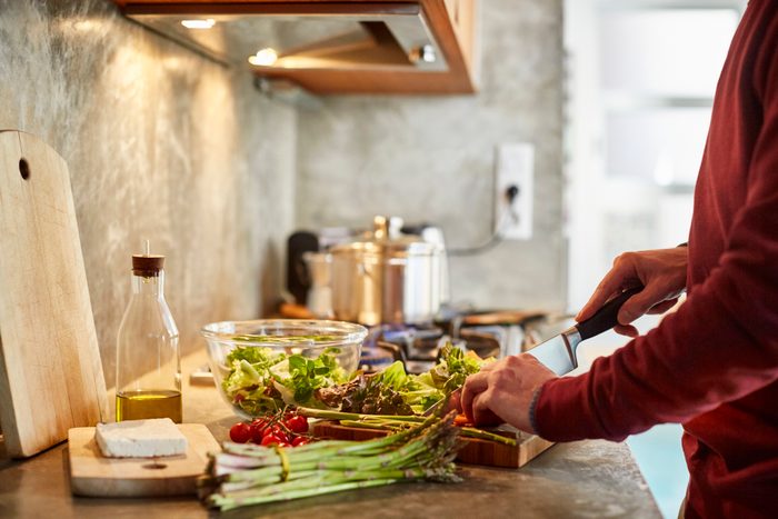 man preparing a healthy meal