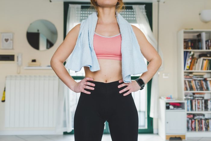 mid section of young woman after work out