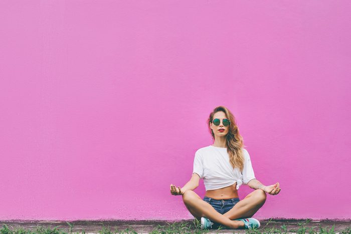 woman meditate wall