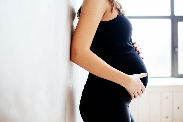 Pregnant lady in black yoga clothes