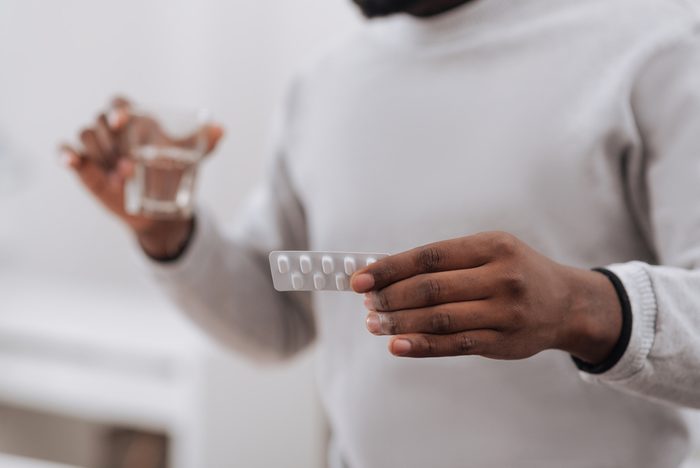 hands holding medication