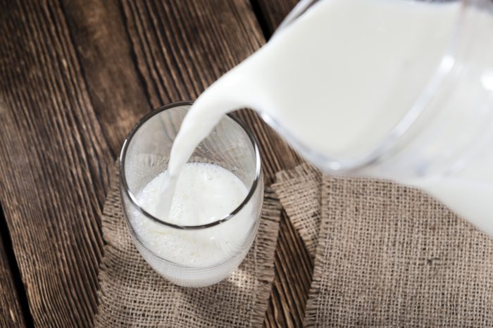 Pouring milk from a pitcher into a glass