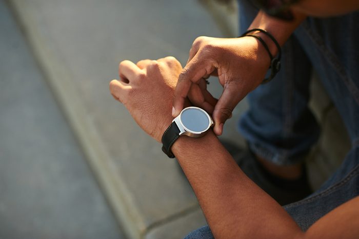 man looking at his watch
