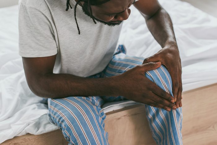 man experiencing aches and pains
