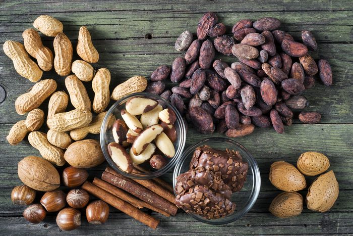 cocoa and nuts of various kinds on wooden table
