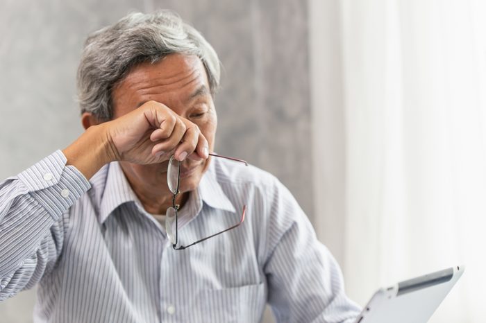Older man with eye irritation