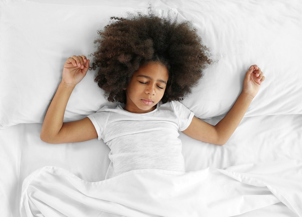 Cute African girl in bed