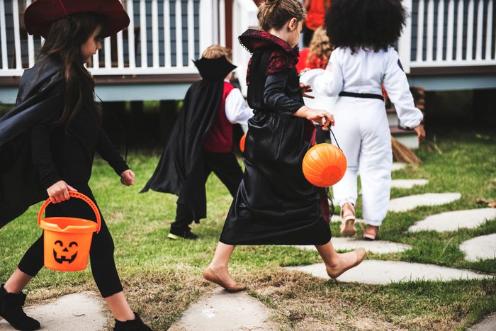 Young kids trick or treating during Halloween