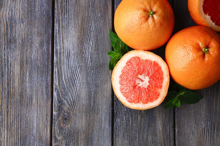 Whole grapefruits and a half grapefruit