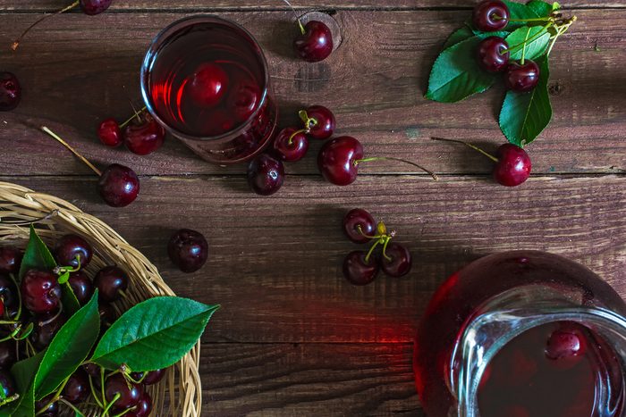 bowl of cherries, cherries on table, and cherry juice