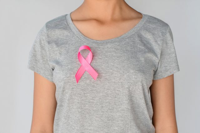 womaen holding pink ribbon breast cancer awareness. concept healthcare and medicine