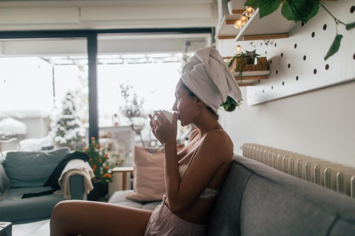 woman with wet hair in towel at home