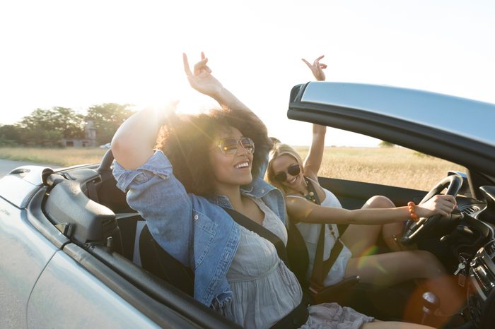 two women in convertible driving