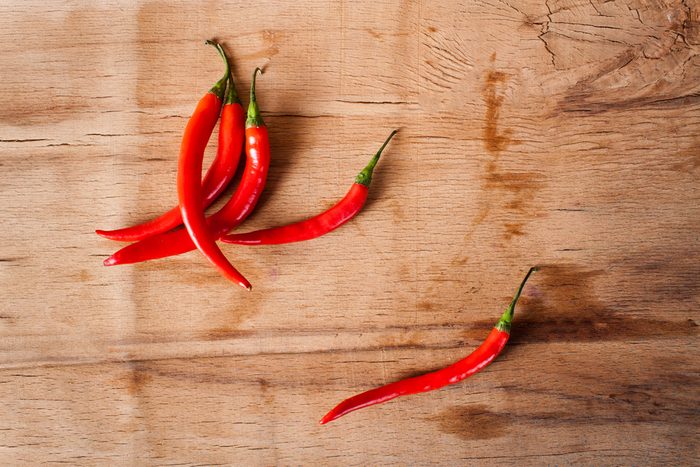Chili peppers on a wooden cutting board