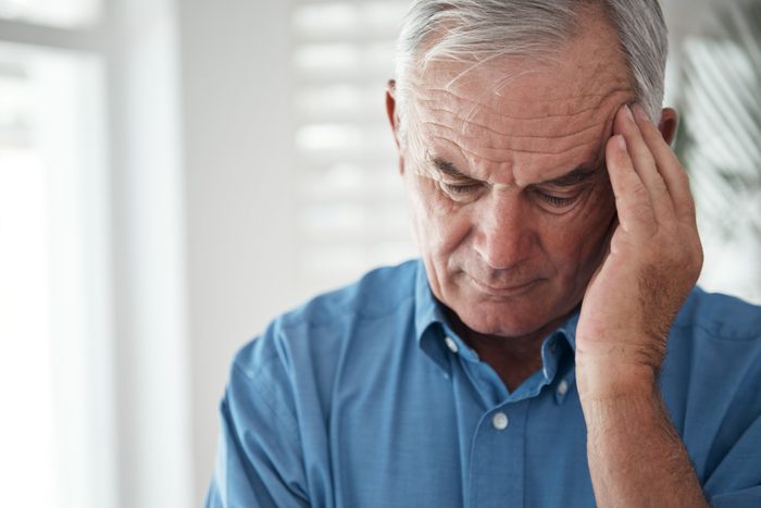 senior man with headache