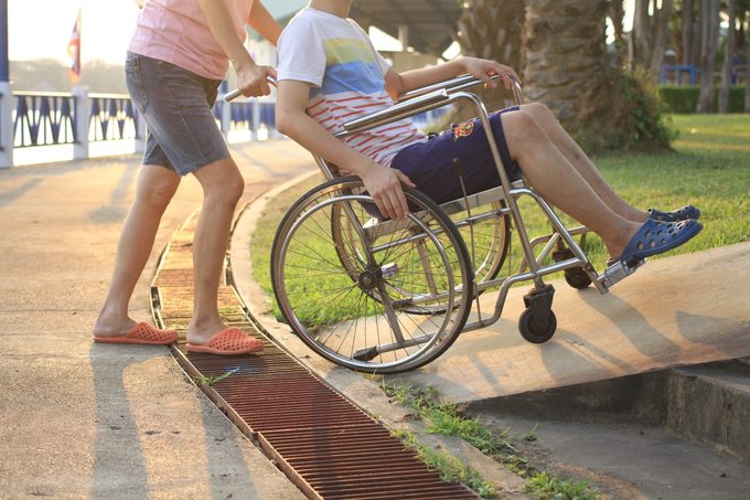 helping disabled person wheelchair help disability