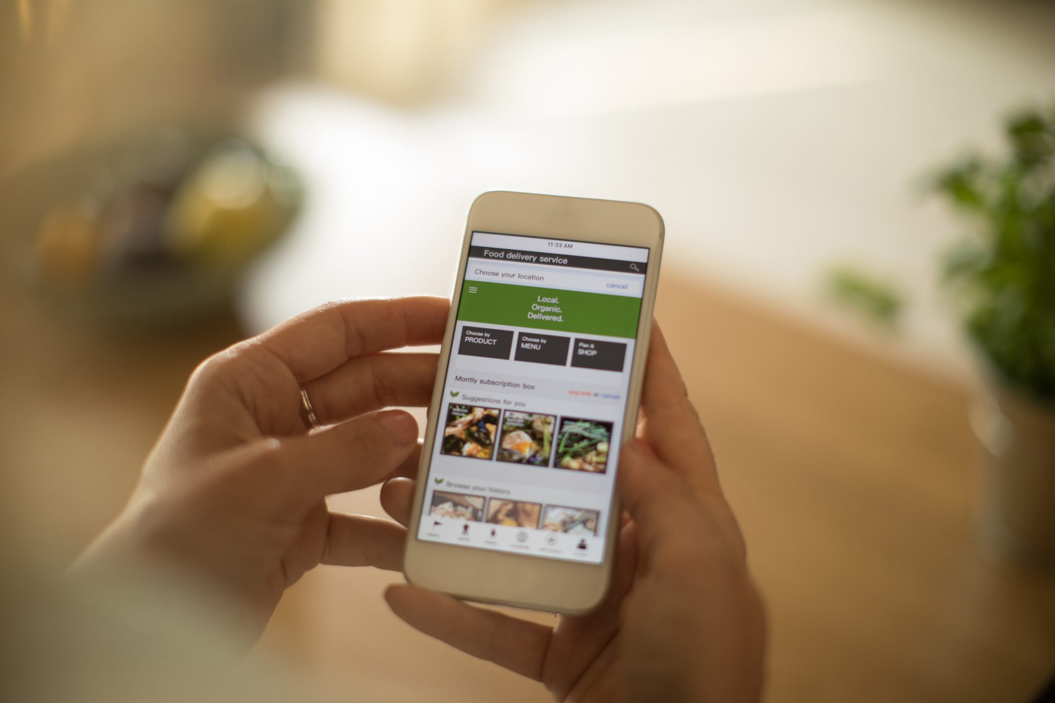 anonymous person using mobile device to order food