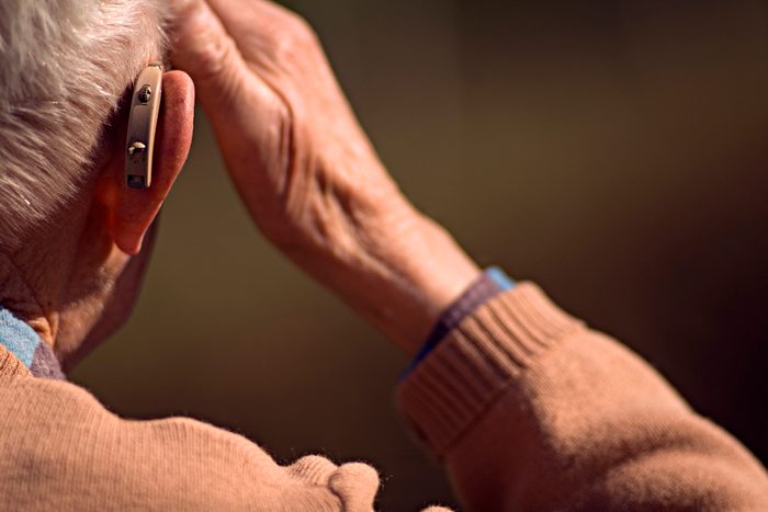 old man with a hearing aid