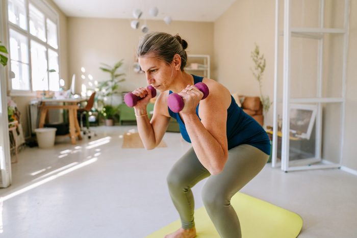 Woman exercising at home