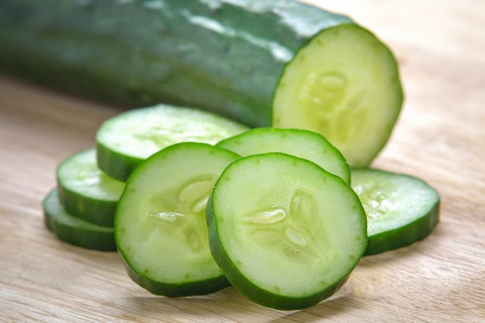 Fresh Cucumber slices on wood background