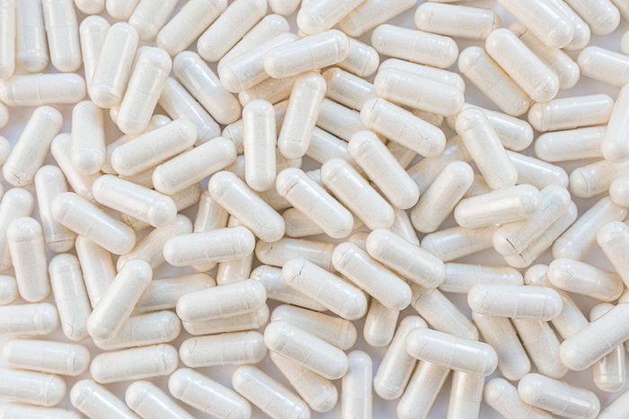 full frame of light colored supplement capsules