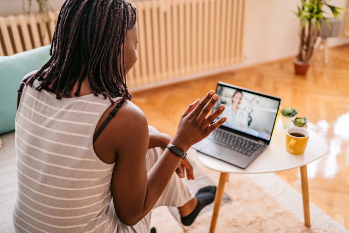 Woman Video Conferencing With Doctor On phone