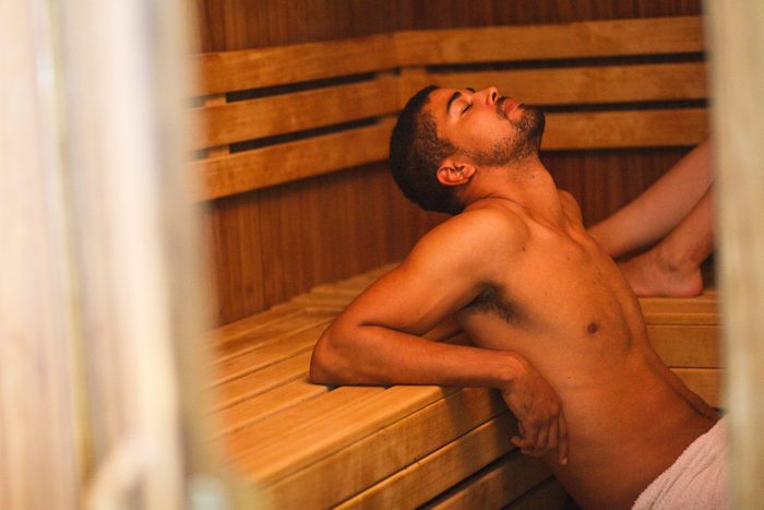 Young man relaxing at sauna