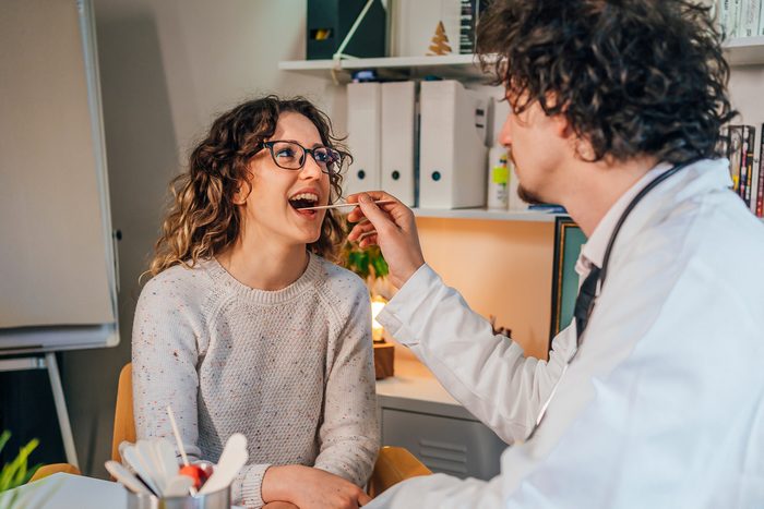 dentist checking female patient