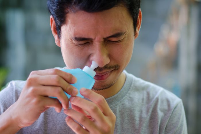 man clearing sinuses