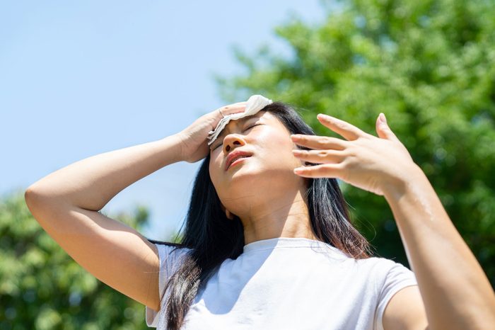 Front view portrait of a stressed teen suffering heat stroke